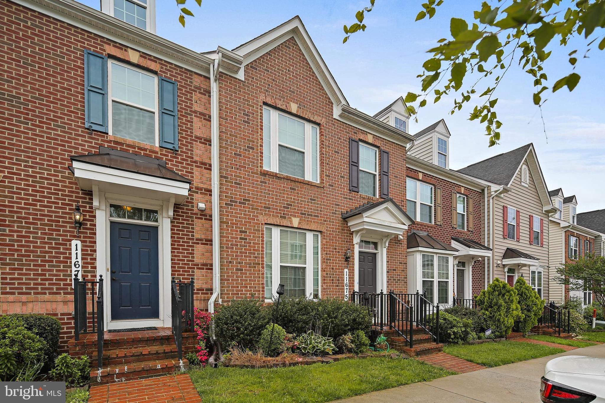 11675 Emerald Green Drive Clarksburg, MD 20871 - Photo 32 of 35 a front view of a multi story residential apartment building
