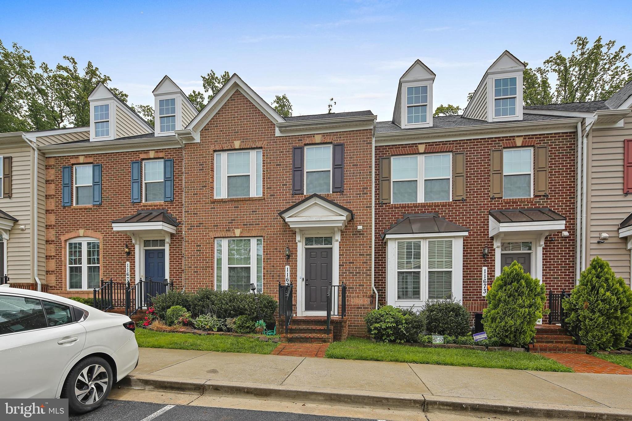 11675 Emerald Green Drive Clarksburg, MD 20871 - Photo 34 of 35 a view of a car parked in front of a brick house