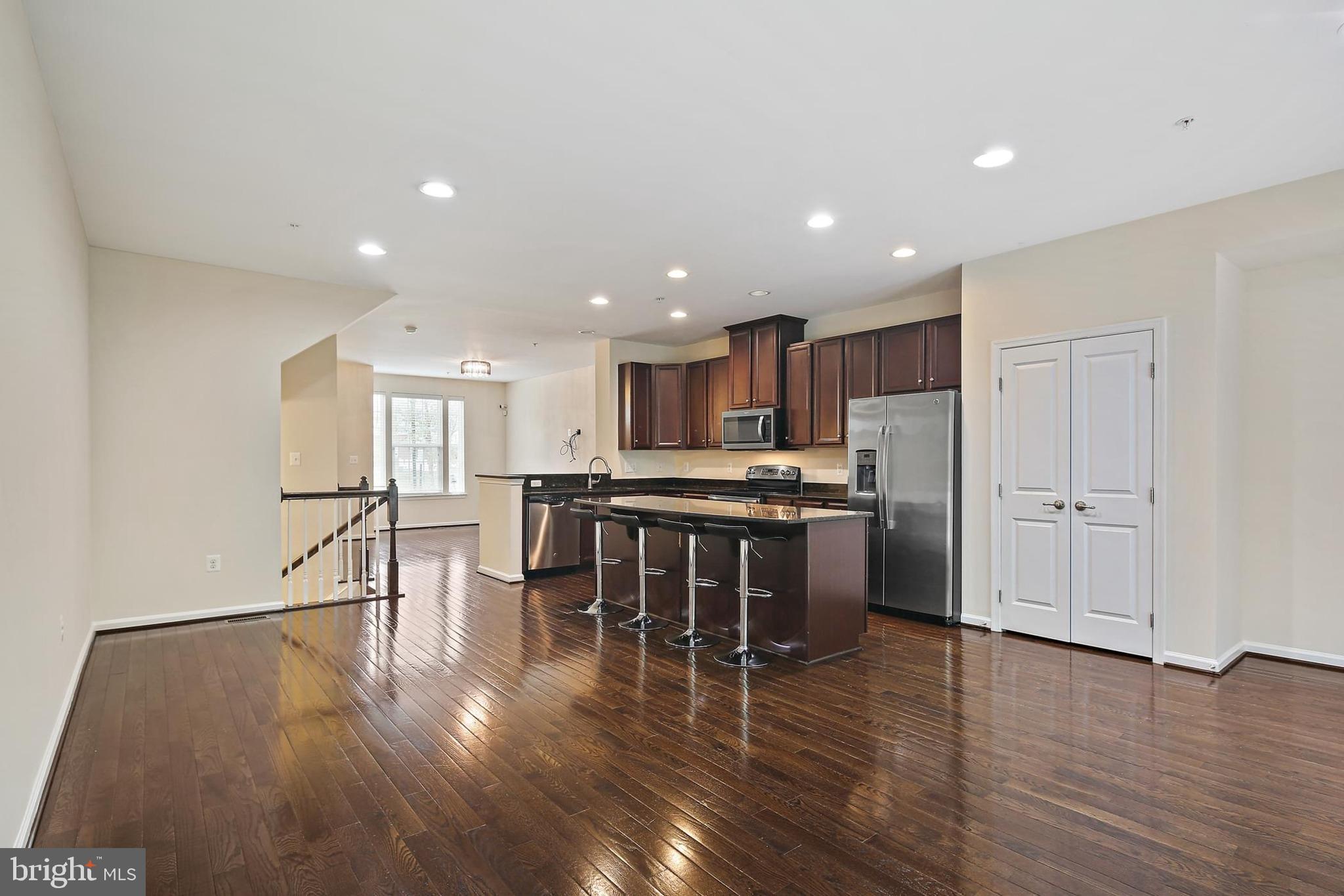 11675 Emerald Green Drive Clarksburg, MD 20871 - Photo 4 of 35 a kitchen with a table and chairs in it