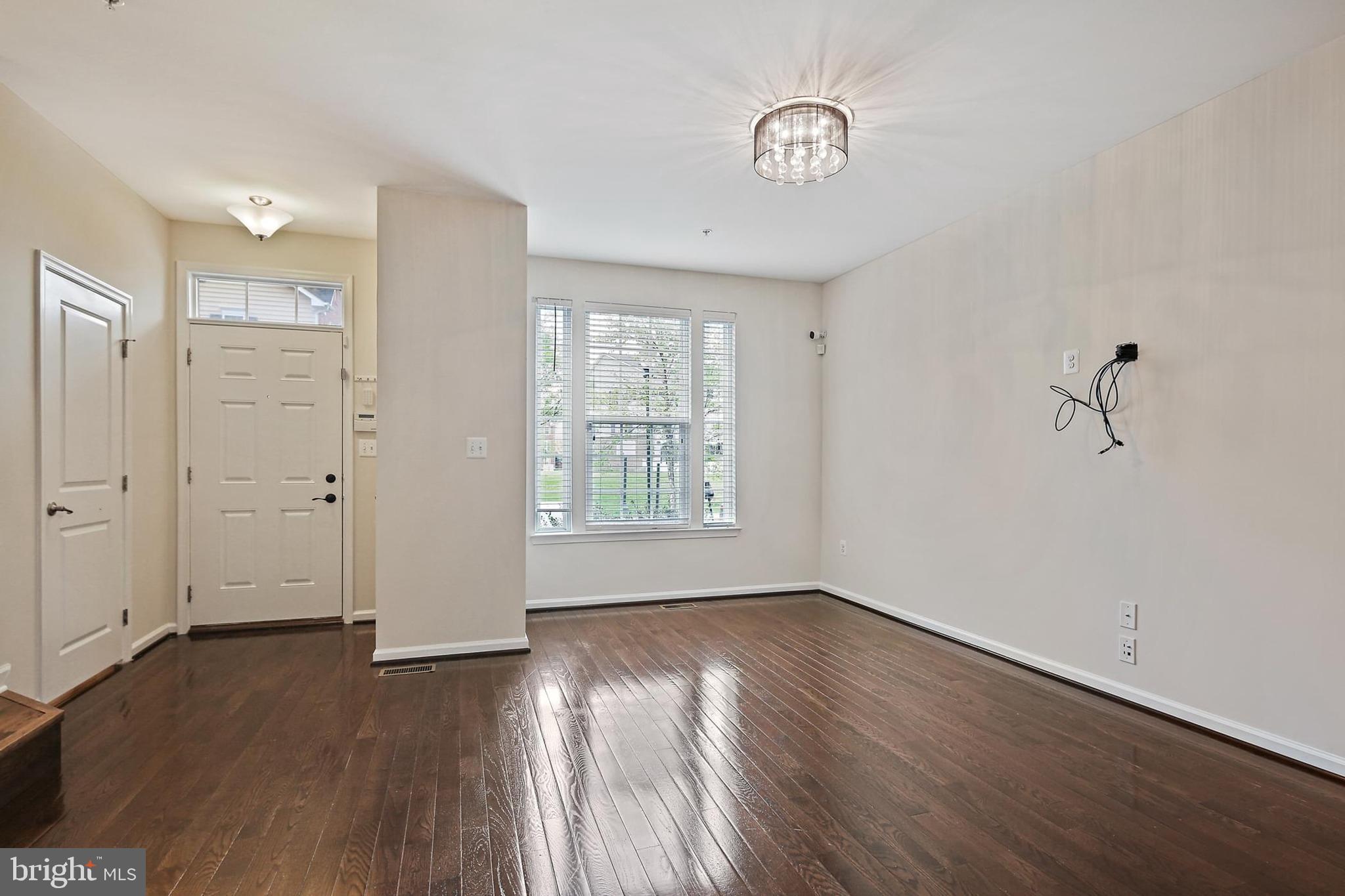 11675 Emerald Green Drive Clarksburg, MD 20871 - Photo 8 of 35 an empty room with wooden floor and windows