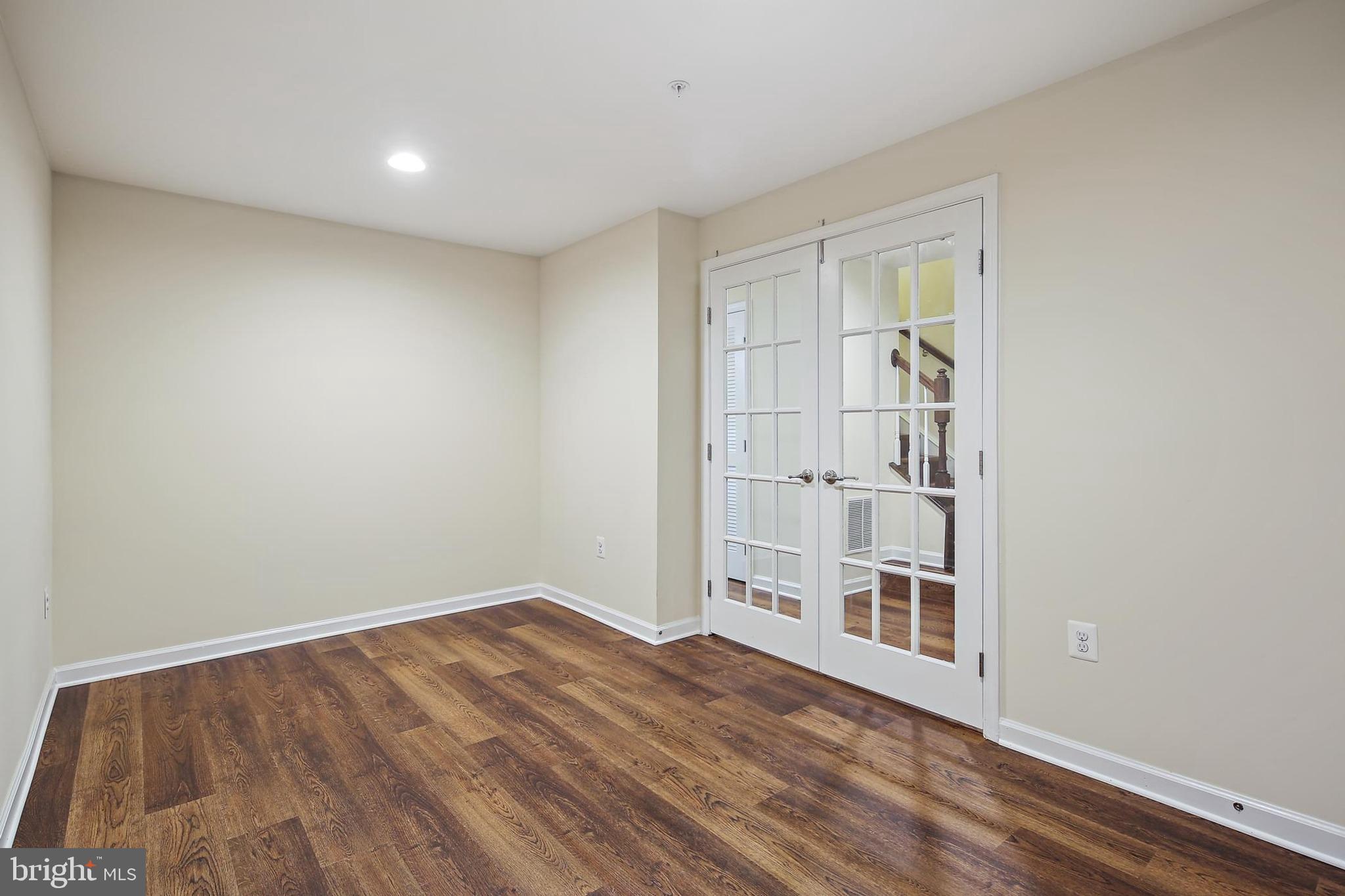 11675 Emerald Green Drive Clarksburg, MD 20871 - Photo 9 of 35 a view of empty room with wooden floor and fan