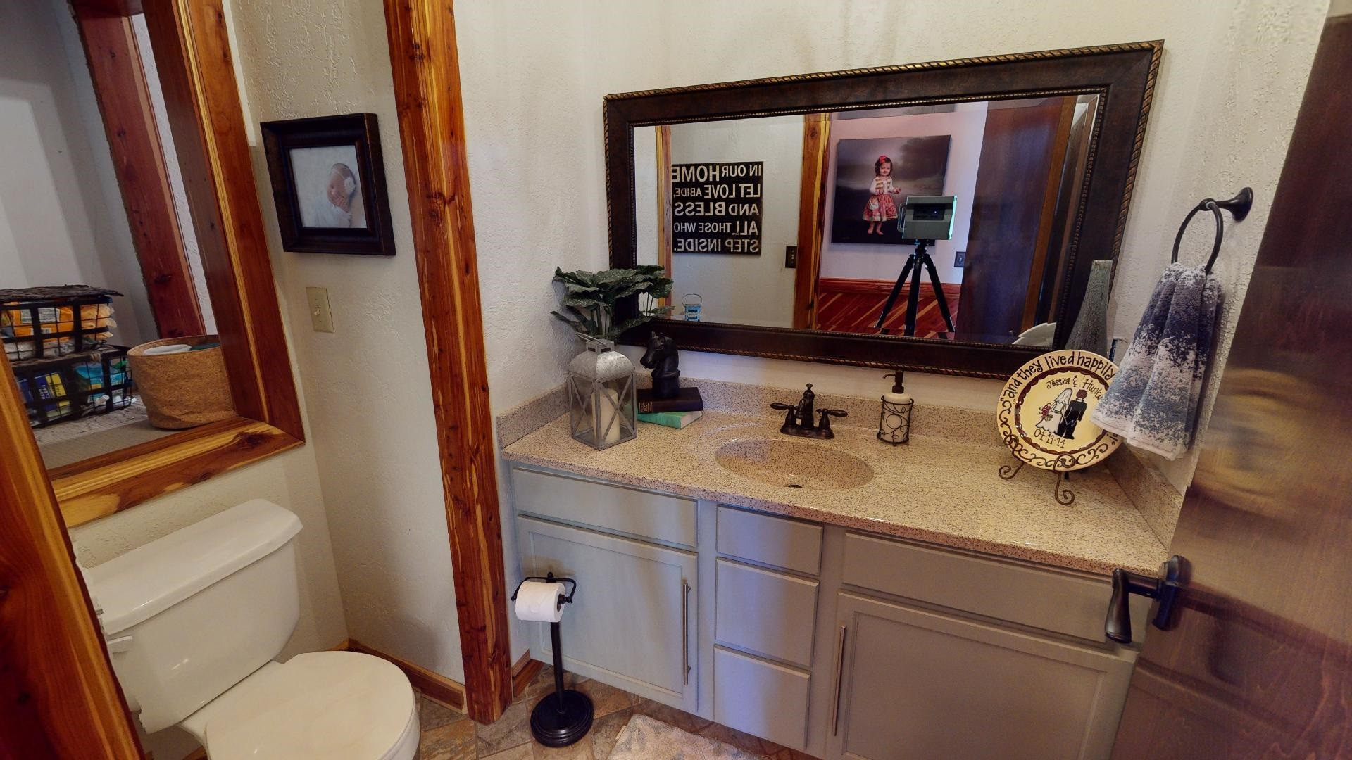 1390 Butler Road Newbern, TN 38059 - Photo 23 of 43 a bathroom with a toilet sink and mirror