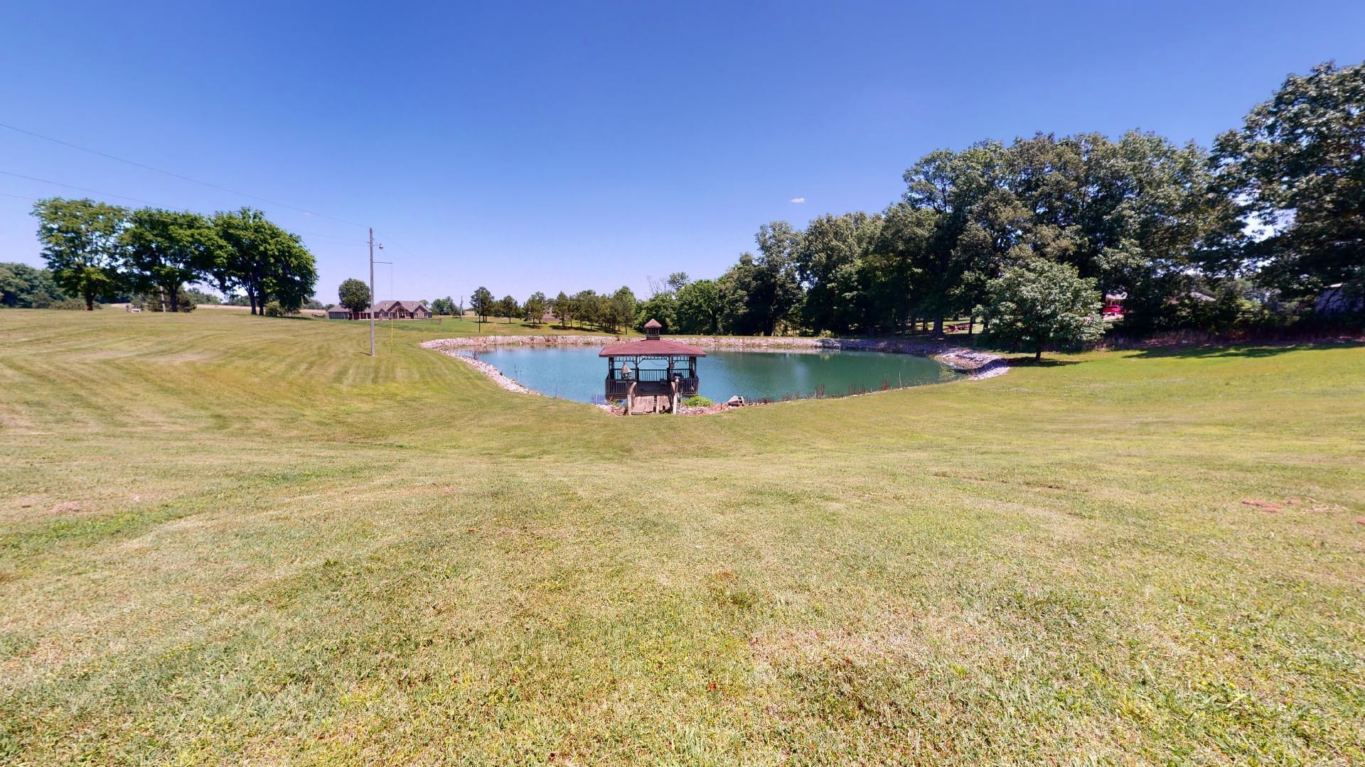 1390 Butler Road Newbern, TN 38059 - Photo 40 of 43 a view of a lake with houses in the back