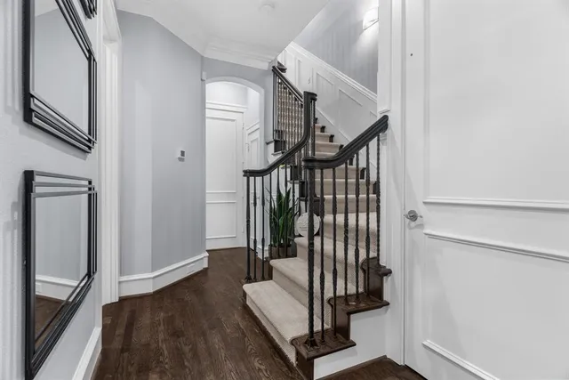 a view of entryway with wooden floor and stairs