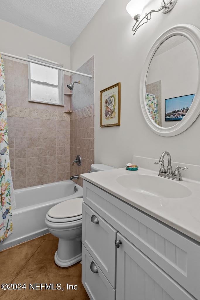 8225 Hardwood Landing Road St. Augustine, FL 32092 - Photo 31 of 126 a bathroom with a sink a toilet and a mirror