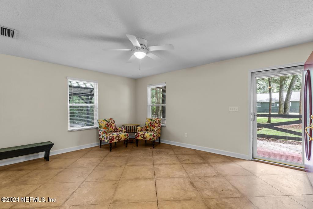 8225 Hardwood Landing Road St. Augustine, FL 32092 - Photo 71 of 126 a living room with furniture and two window