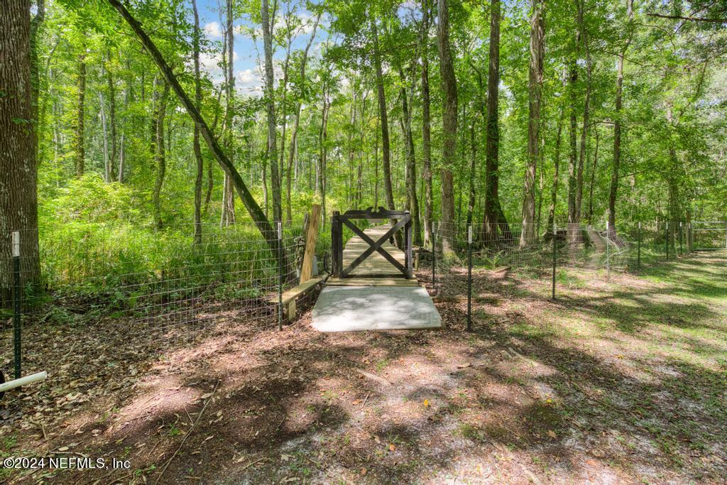 8225 Hardwood Landing Road St. Augustine, FL 32092 - Photo 96 of 126 a view of outdoor space with deck and yard
