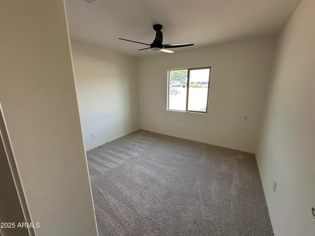 a bathroom with a double vanity sink toilet and a mirror