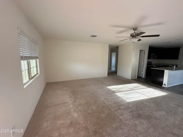 a view of a kitchen with a sink and a stove top oven