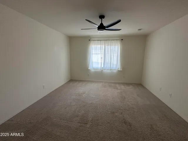 a bathroom with a tub and a glass door