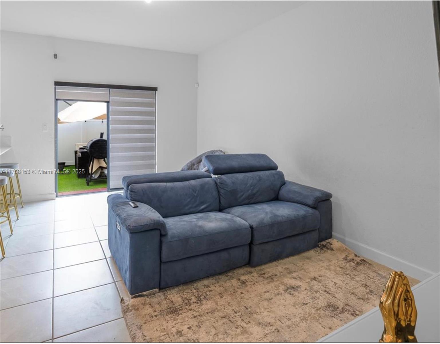 11426 West 33rd Way Hialeah, FL 33018 - Photo 5 of 14 a living room with a couch