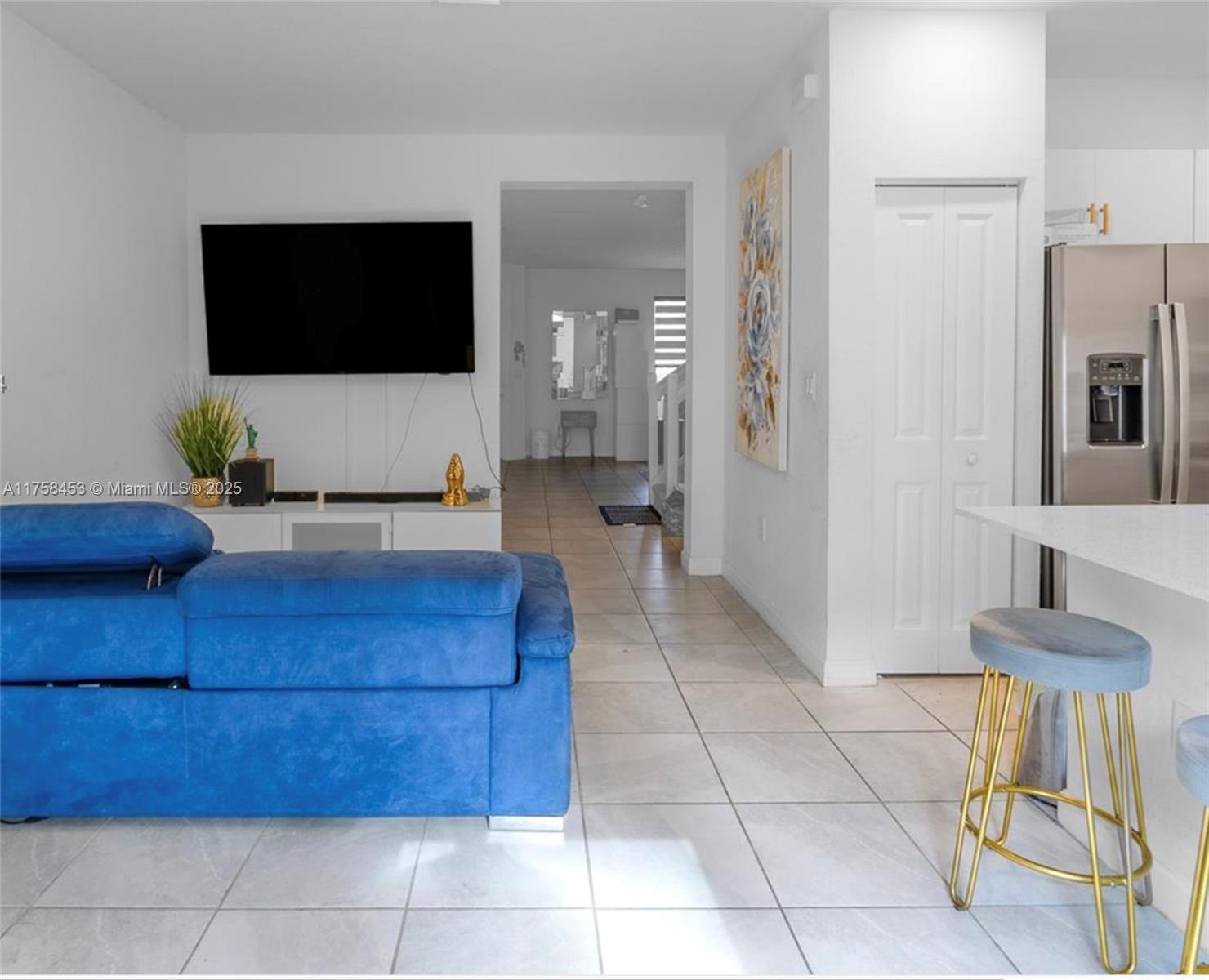 11426 West 33rd Way Hialeah, FL 33018 - Photo 6 of 14 a living room with furniture and a flat screen tv