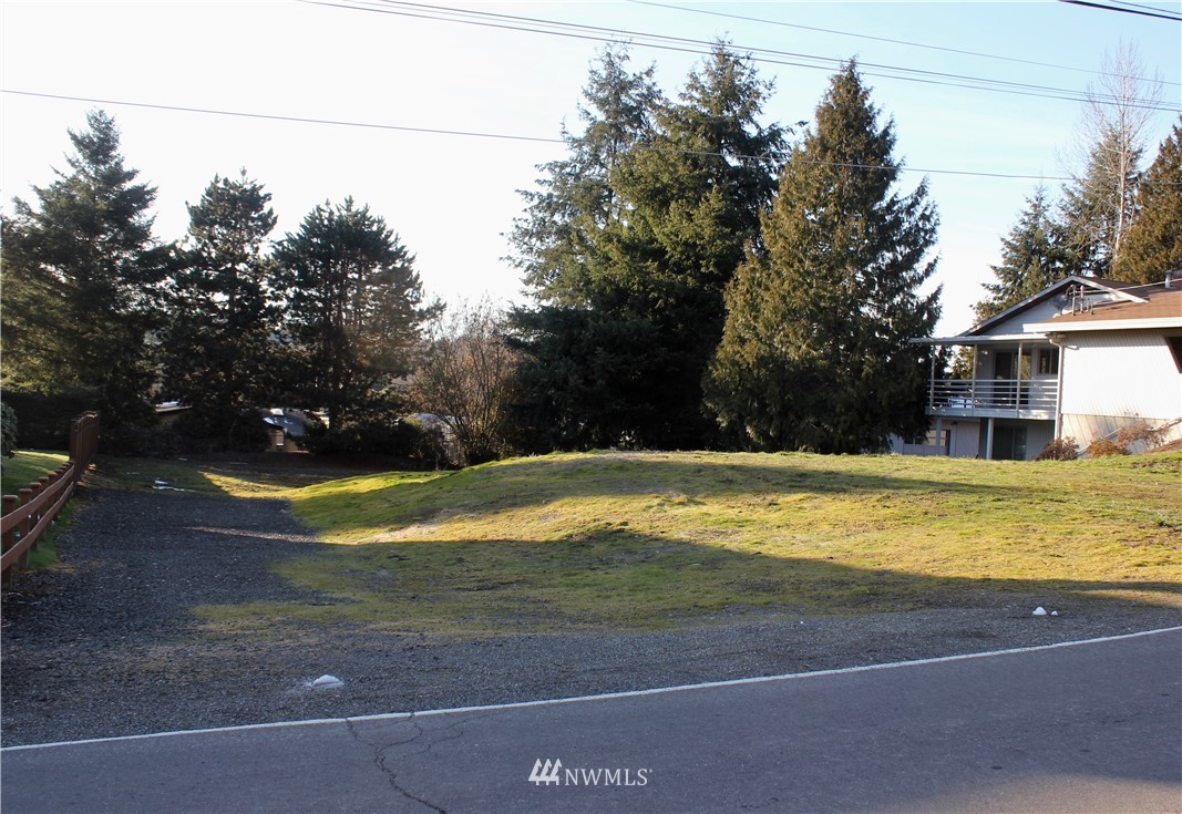0 7th Place West Bothell, WA 98021 - Photo 1 of 12 a view of a house with a yard