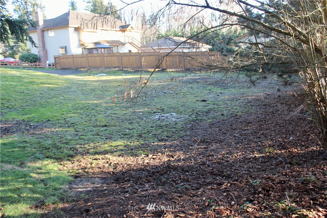 0 7th Place West Bothell, WA 98021 - Photo 6 of 12 a view of a yard with a tree