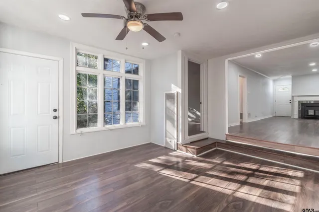 a view of livingroom with hardwood floor and a ceiling fan