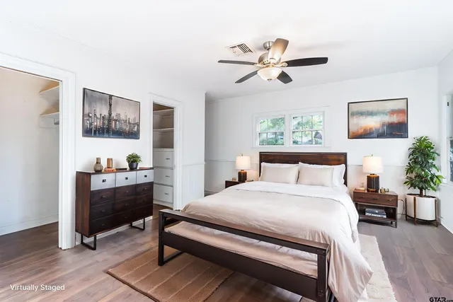 a bedroom with a bed and a table