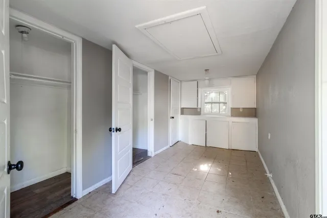 a view of a kitchen with a sink and dishwasher refrigerator freezer