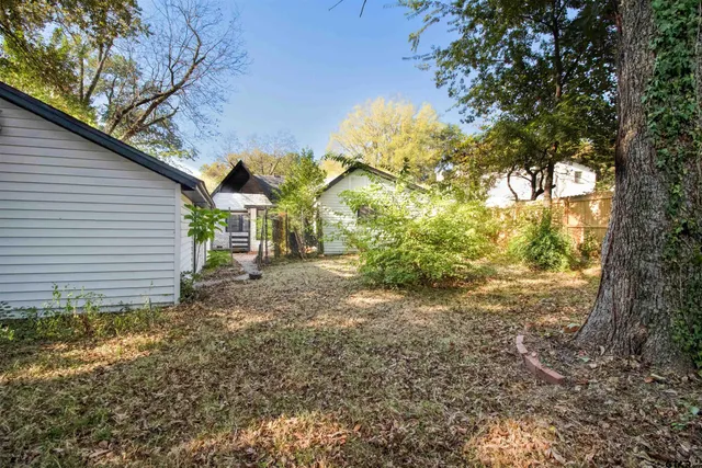 a view of a house with a tree