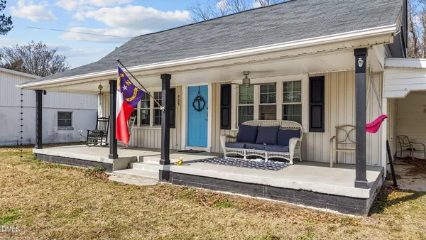 a building exterior with a table and chairs