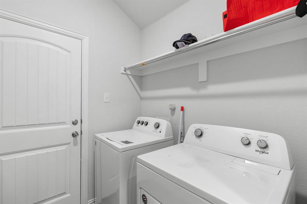 14580 Gully Place Dallas, TX 75253 - Photo 24 of 30 a utility room with dryer and washer