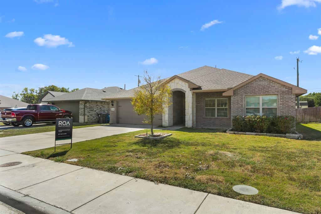 14580 Gully Place Dallas, TX 75253 - Photo 3 of 30 a front view of a house with a garden