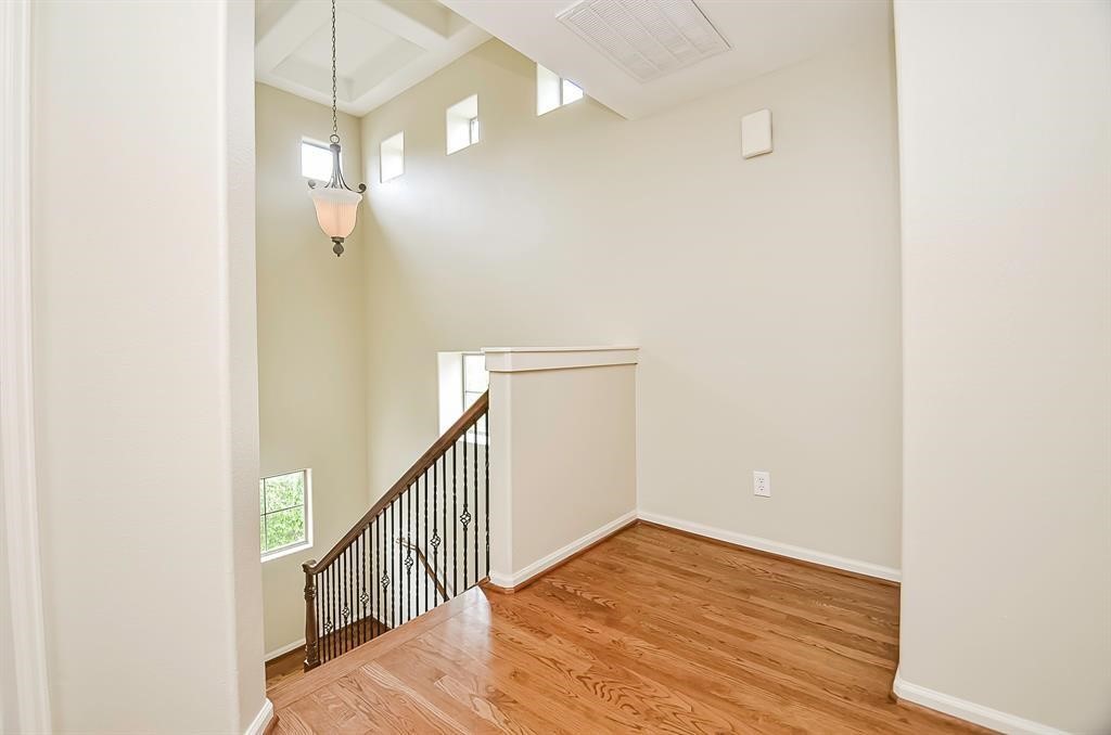 222 Knox Street, Unit F Houston, TX 77007 - Photo 21 of 36 a view of a hallway with wooden floor