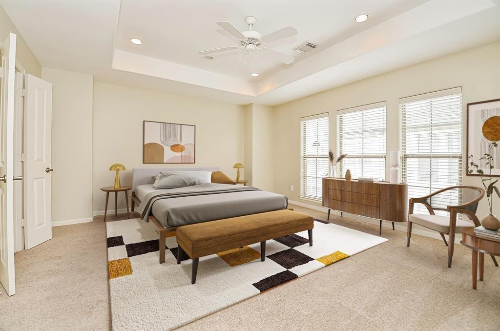 222 Knox Street, Unit F Houston, TX 77007 - Photo 27 of 36 a spacious bedroom with a bed a table and chair