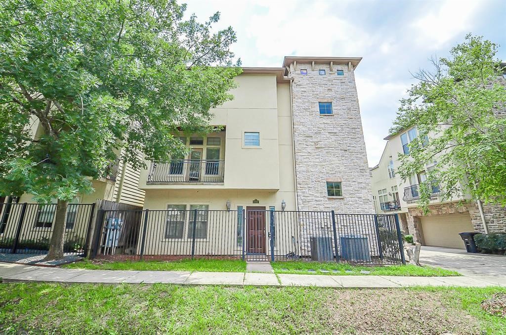 222 Knox Street, Unit F Houston, TX 77007 - Photo 36 of 36 a view of a house next to a big yard and large tree