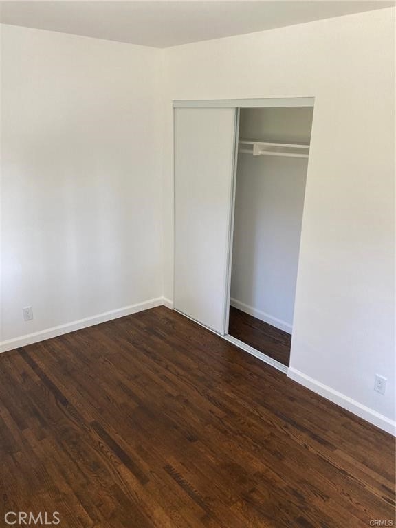 8312 Barnsley Avenue Los Angeles, CA 90045 - Photo 14 of 17 a view of an empty room with wooden floor and a window
