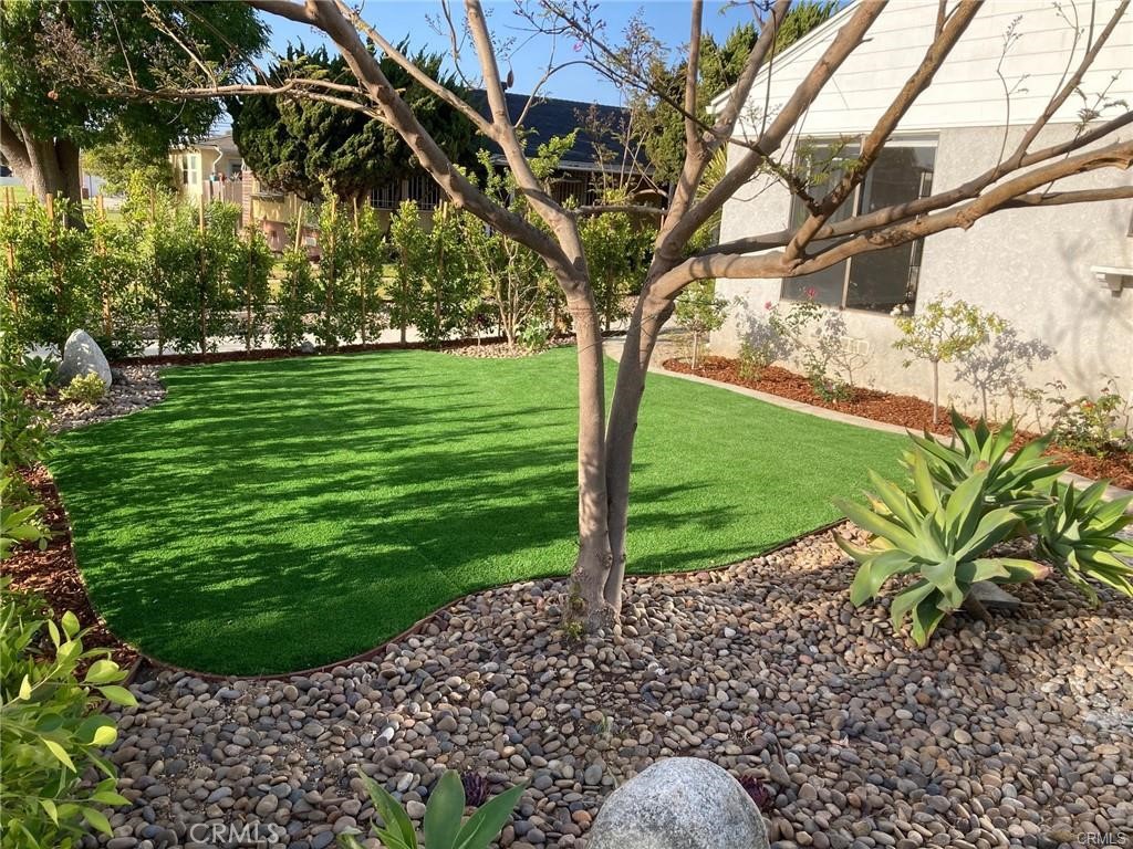 8312 Barnsley Avenue Los Angeles, CA 90045 - Photo 17 of 17 a view of a garden with a tree