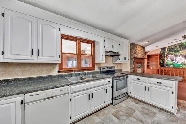 a view of livingroom with hardwood floor and a ceiling fan