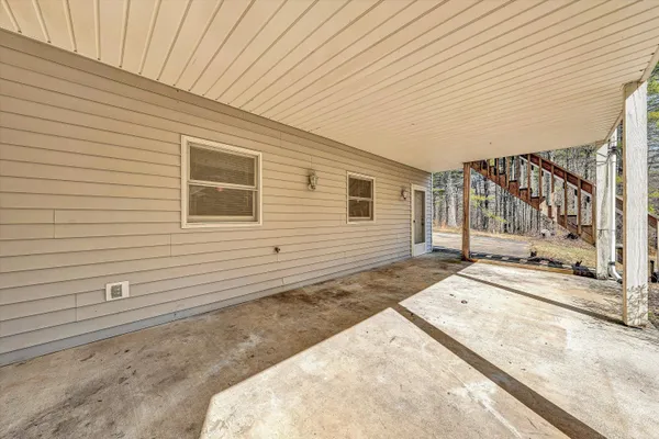 a view of outdoor space with wooden fence
