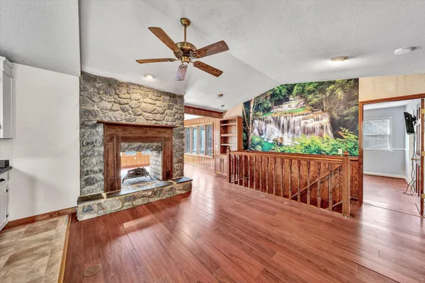 a kitchen with stainless steel appliances granite countertop a refrigerator a stove and a sink