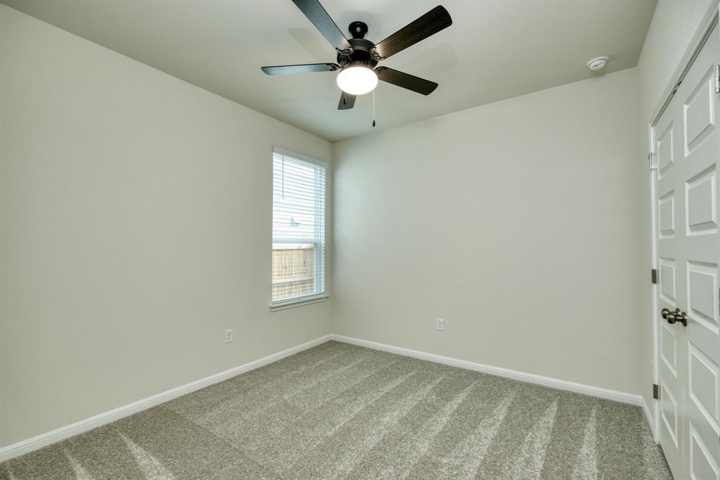 8307 Haflinger Drive Austin, TX 78747 - Photo 5 of 13 Unfurnished bedroom with carpet flooring and a ceiling fan