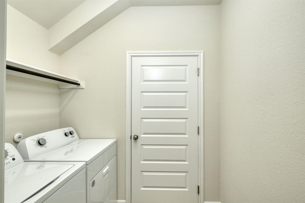 8307 Haflinger Drive Austin, TX 78747 - Photo 9 of 13 Laundry room with washing machine and dryer
