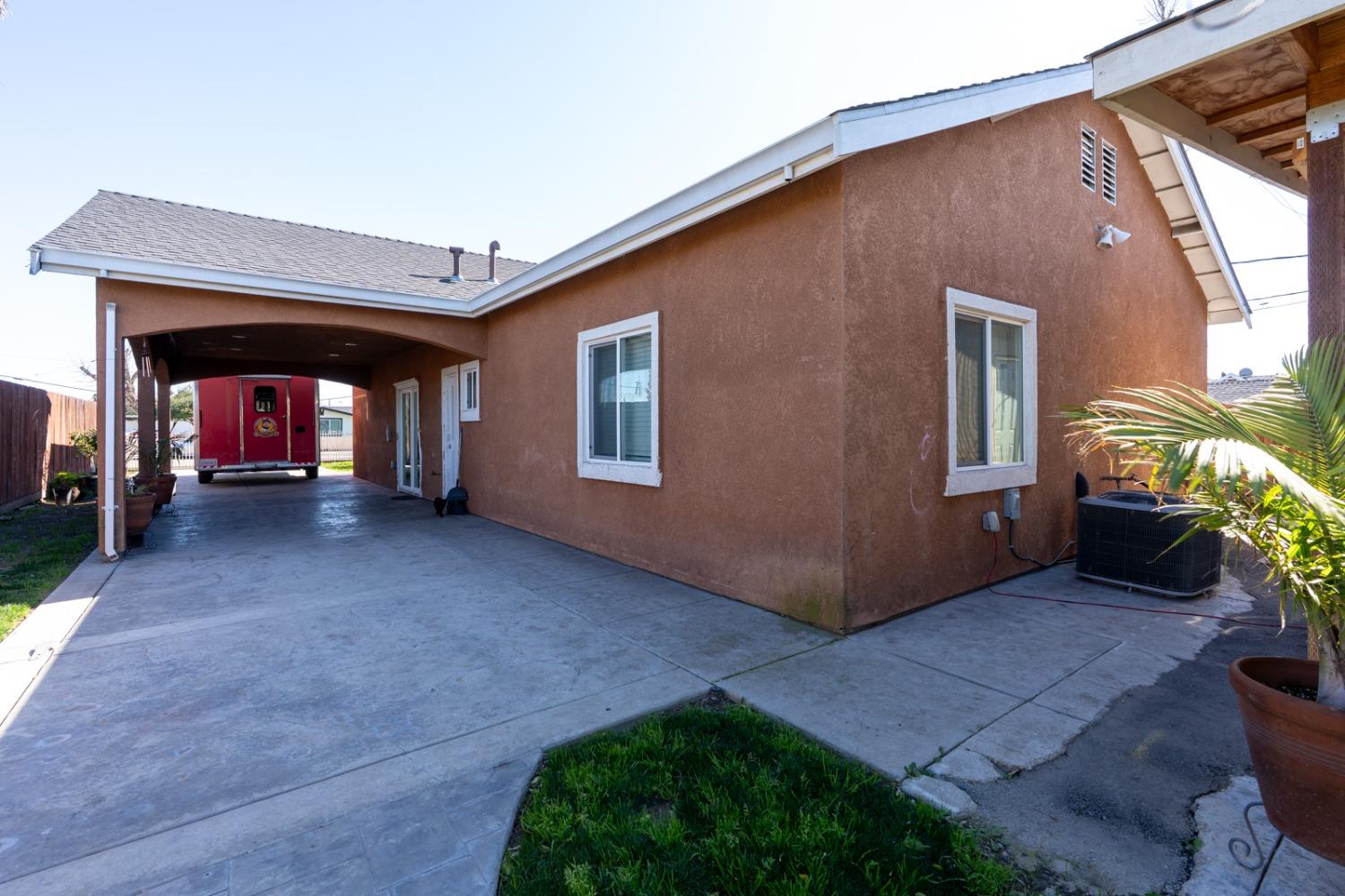 509 Kerr Avenue Modesto, CA 95354 - Photo 11 of 55 a view of a house with porch and a yard