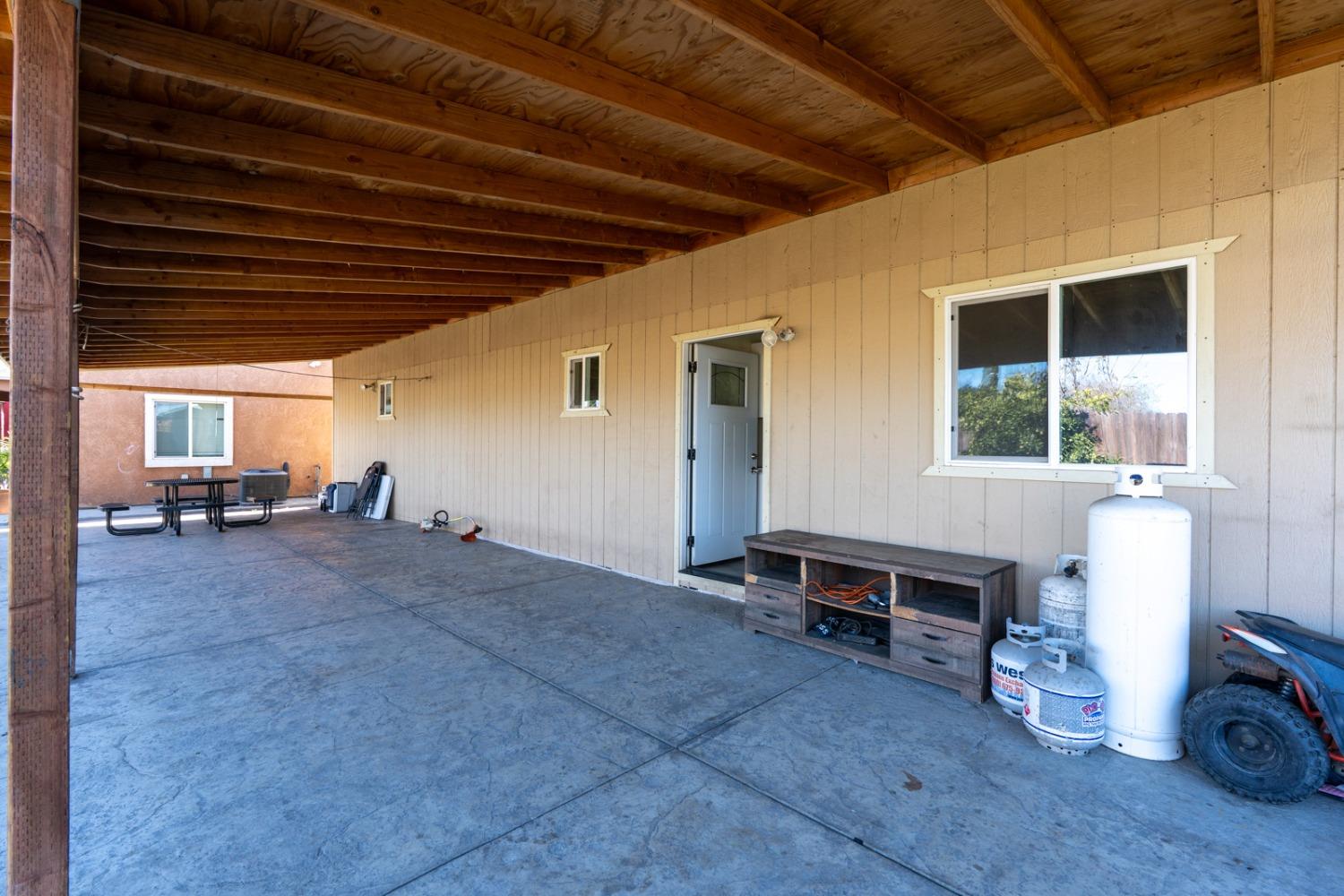 509 Kerr Avenue Modesto, CA 95354 - Photo 18 of 55 a view of a house with a backyard and sitting area