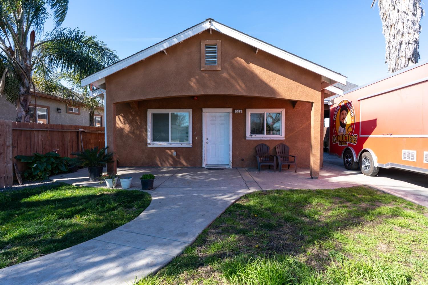 509 Kerr Avenue Modesto, CA 95354 - Photo 2 of 55 a front view of a house with a yard and porch