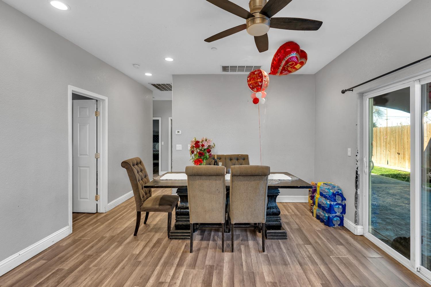 509 Kerr Avenue Modesto, CA 95354 - Photo 24 of 55 a view of a dining room with furniture window and wooden floor
