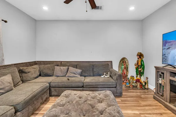 a bedroom with a bed and a dresser