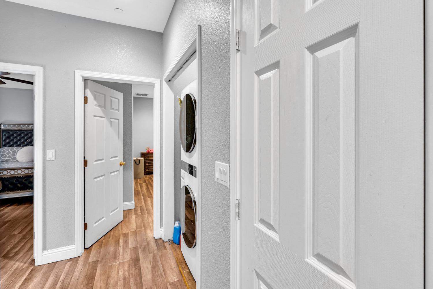 509 Kerr Avenue Modesto, CA 95354 - Photo 30 of 55 a view of a hallway with wooden floor and staircase