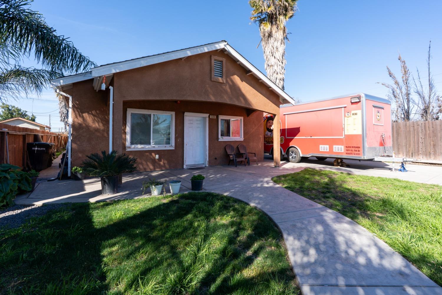 509 Kerr Avenue Modesto, CA 95354 - Photo 3 of 55 a front view of a house with garden