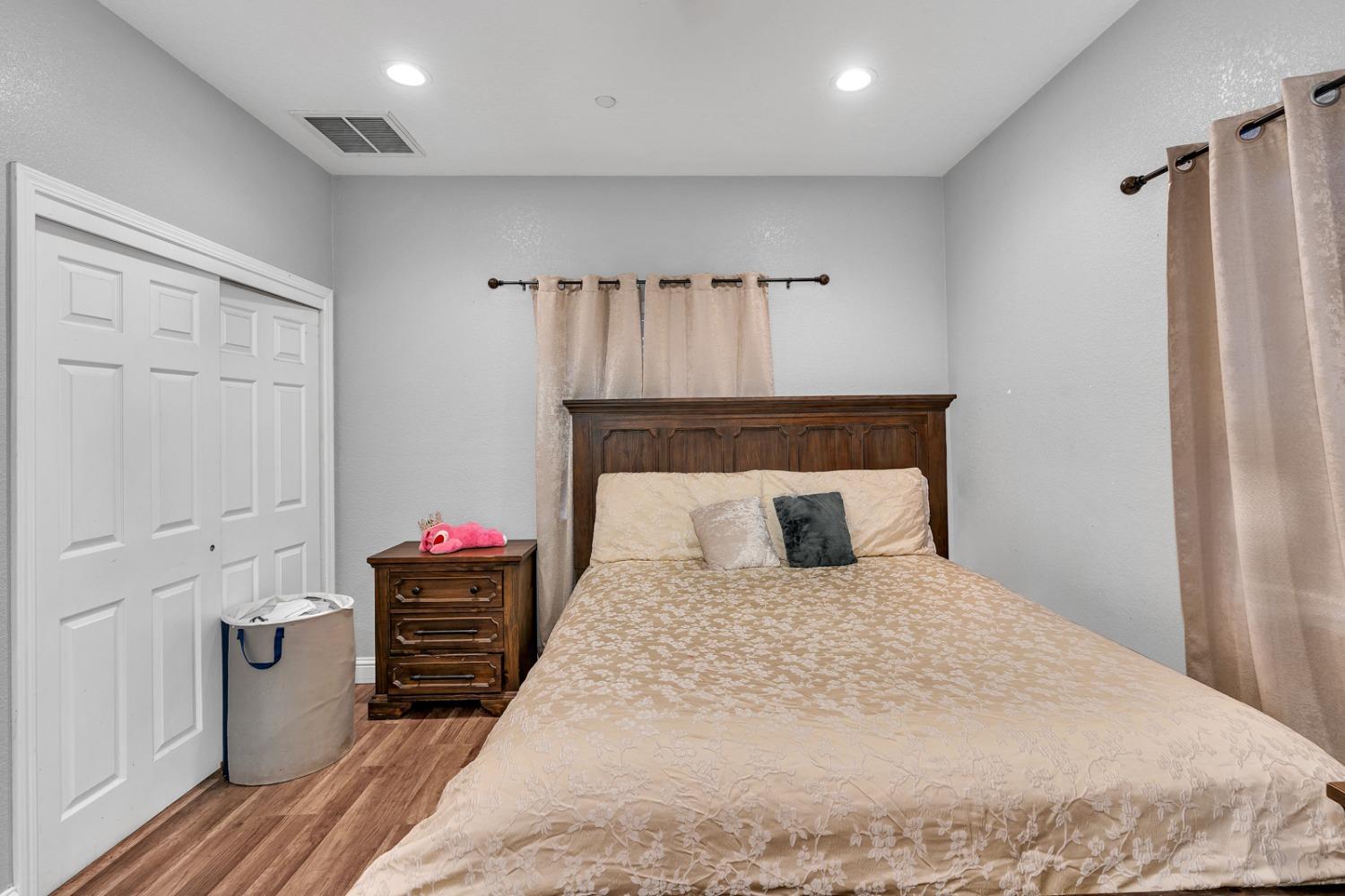 509 Kerr Avenue Modesto, CA 95354 - Photo 32 of 55 a bedroom with a bed and a dresser