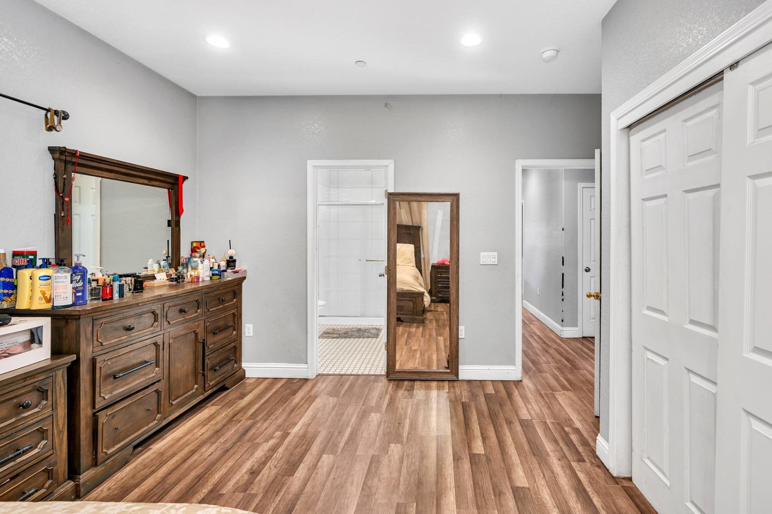 509 Kerr Avenue Modesto, CA 95354 - Photo 33 of 55 a view of a kitchen from the hallway with a wooden floor