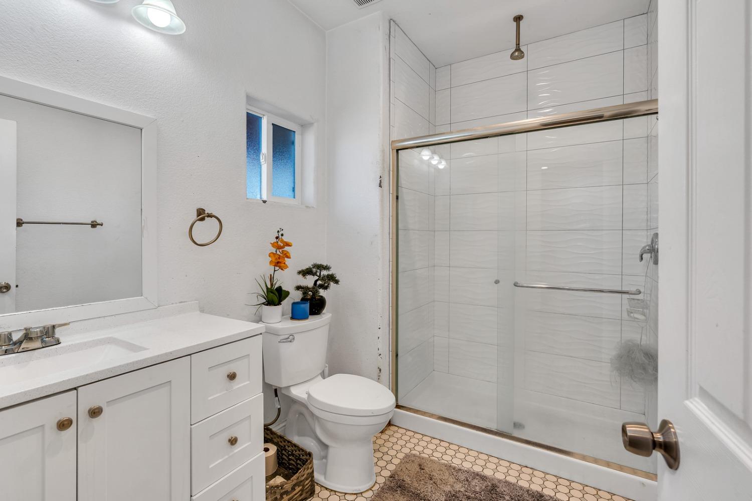 509 Kerr Avenue Modesto, CA 95354 - Photo 34 of 55 a bathroom with a sink toilet and shower