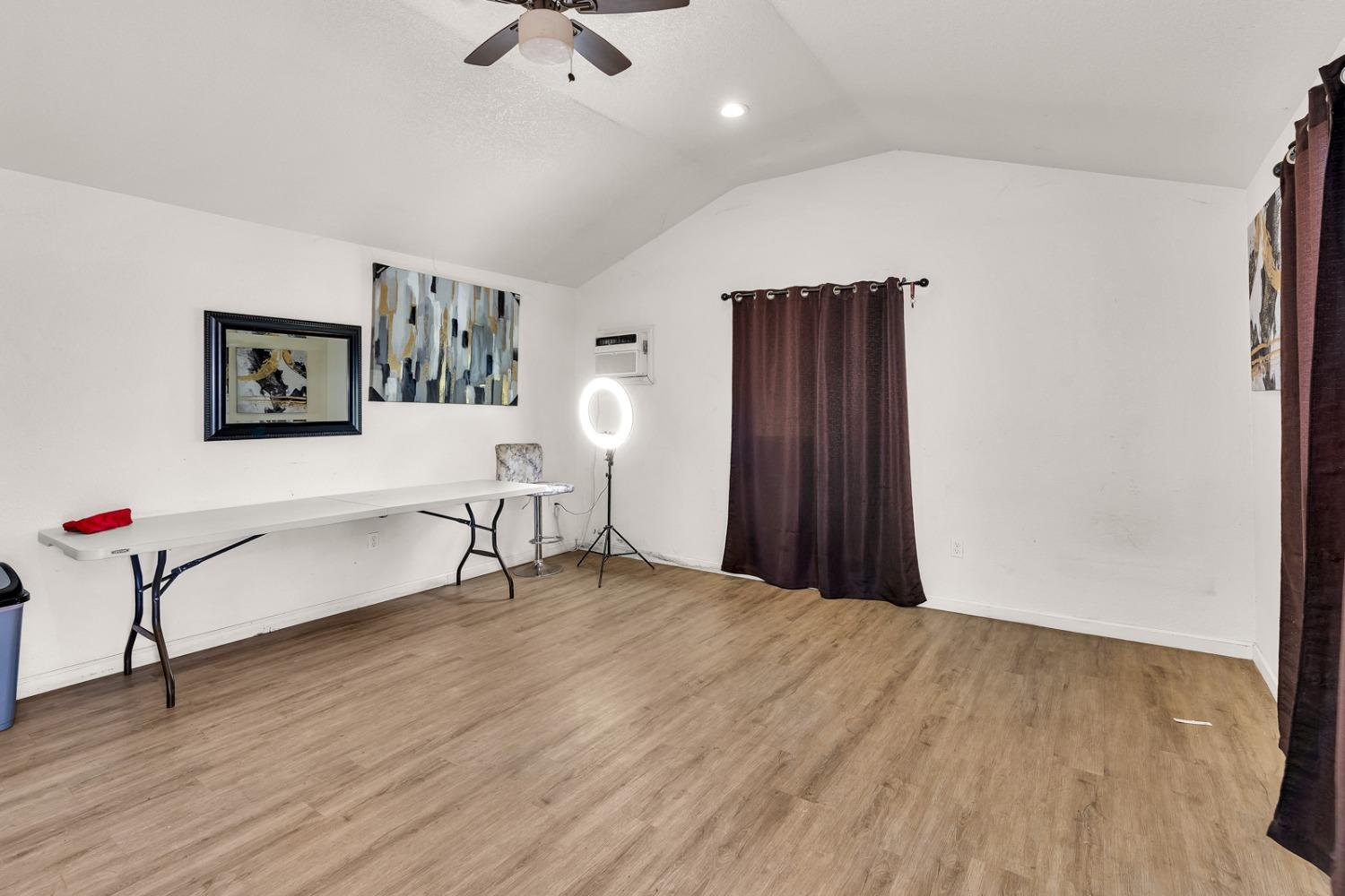 509 Kerr Avenue Modesto, CA 95354 - Photo 36 of 55 a view of a livingroom with a flat screen tv and wooden floor