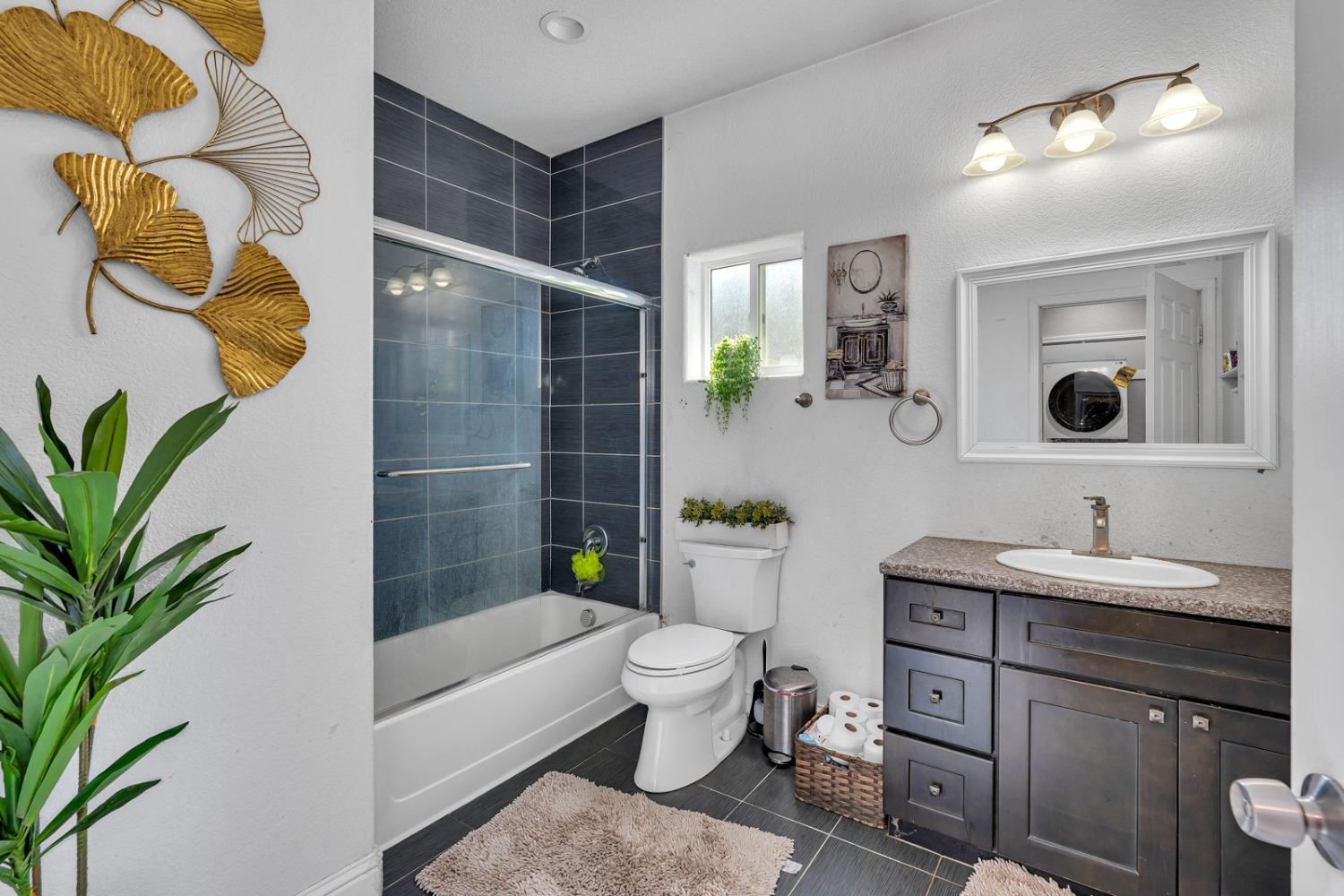 509 Kerr Avenue Modesto, CA 95354 - Photo 38 of 55 a bathroom with a sink a toilet and shower
