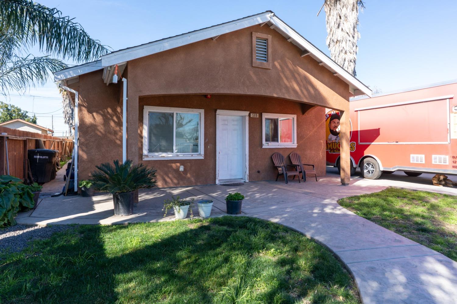 509 Kerr Avenue Modesto, CA 95354 - Photo 4 of 55 a front view of a house with garden