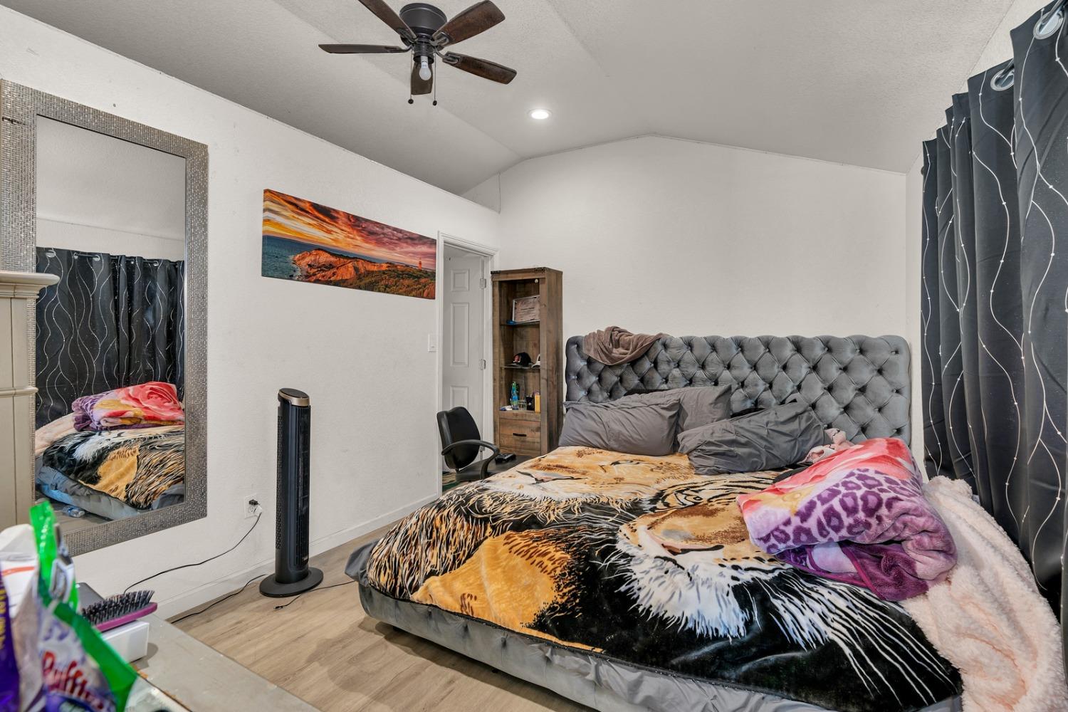 509 Kerr Avenue Modesto, CA 95354 - Photo 43 of 55 a bedroom with a bed and a painting on the wall