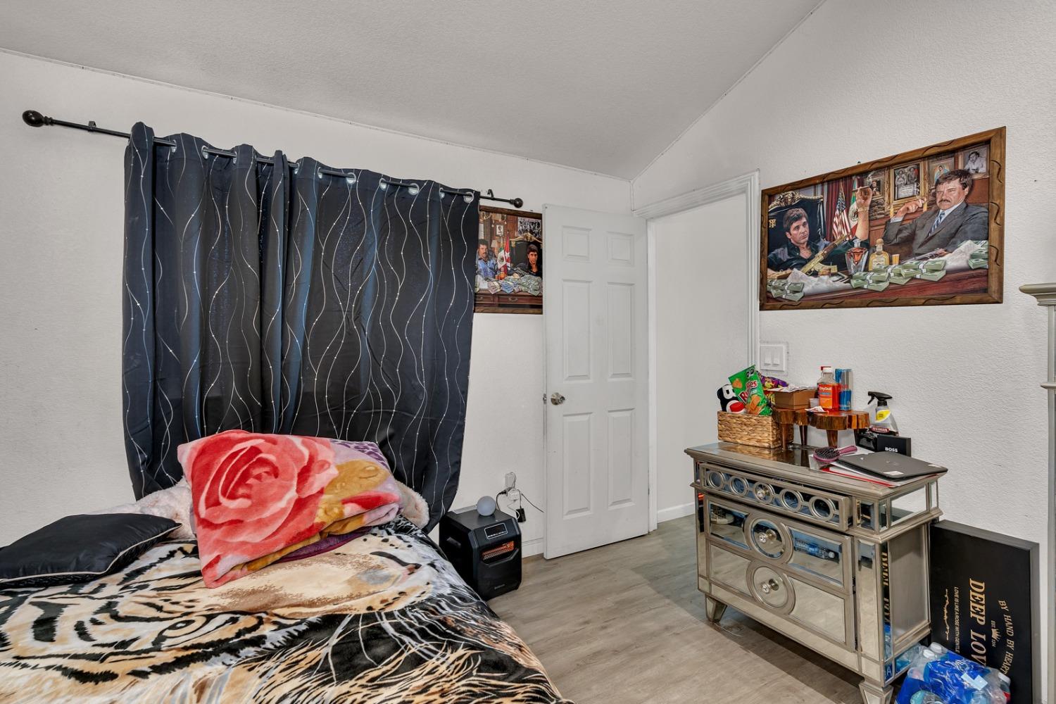 509 Kerr Avenue Modesto, CA 95354 - Photo 44 of 55 a bedroom with a bed and wooden floor